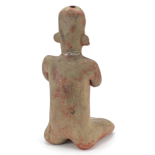180 - South American pottery figure of a nude figure kneeling, 40.5cm high