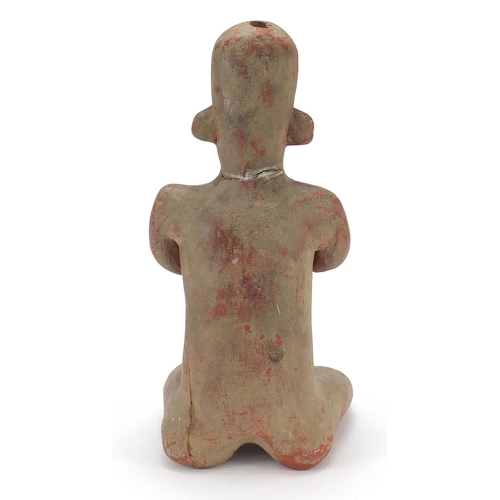 180 - South American pottery figure of a nude figure kneeling, 40.5cm high