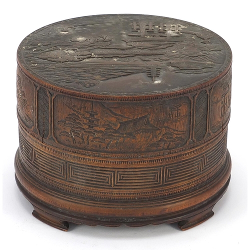 57 - Chinese cylindrical bamboo box and cover finely carved with a landscape, 11.5cm high x 16.5cm in dia... 