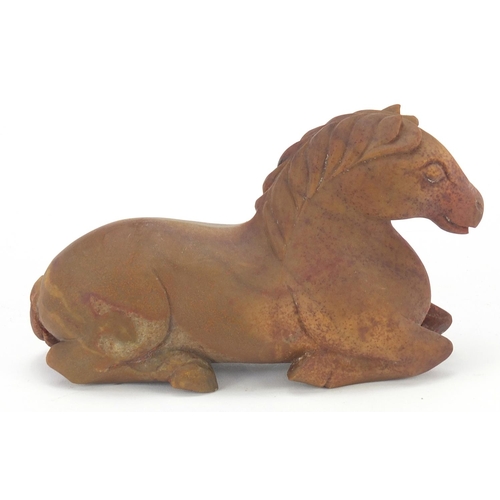 42 - Chinese hardstone carving of a recumbent horse, possibly jade, 15.5cm in length