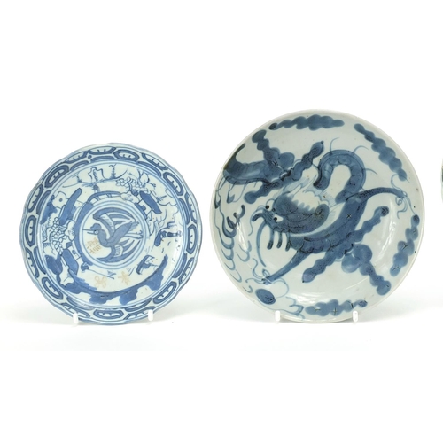 18 - Four Chinese blue and white porcelain plates including one painted with two deer, two having charact... 