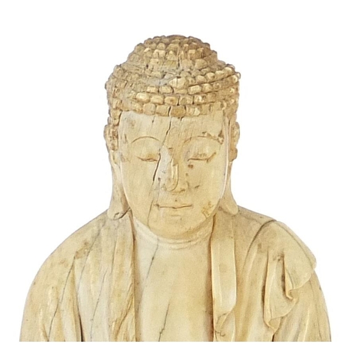 37 - Chinese ivory carving of seated Buddha, character marks to the base, 11cm high