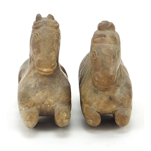 43 - Pair of Chinese carved hardstone recumbent horses, possibly jade, the largest 12cm in length