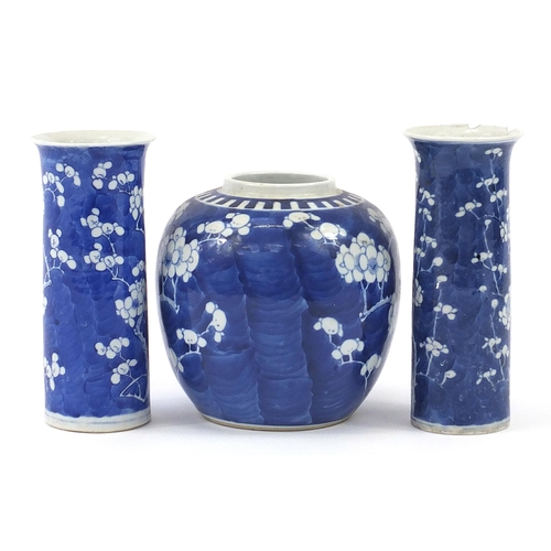 19 - Chinese blue and white porcelain hand painted with prunus flowers comprising two cylindrical vases a... 