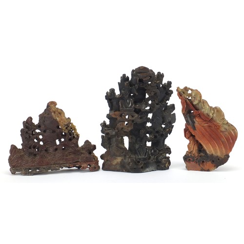 48 - Three Chinese soapstone landscape carvings including one of two immortals amongst clouds, the larges... 