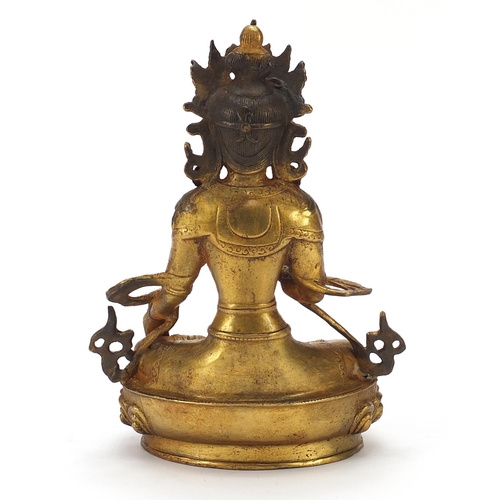 52 - Chino Tibetan gilt bronze figure of seated buddha, 20cm high