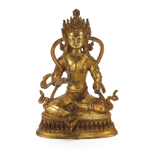 85 - Chino Tibetan gilt bronze figure of buddha, 22cm high