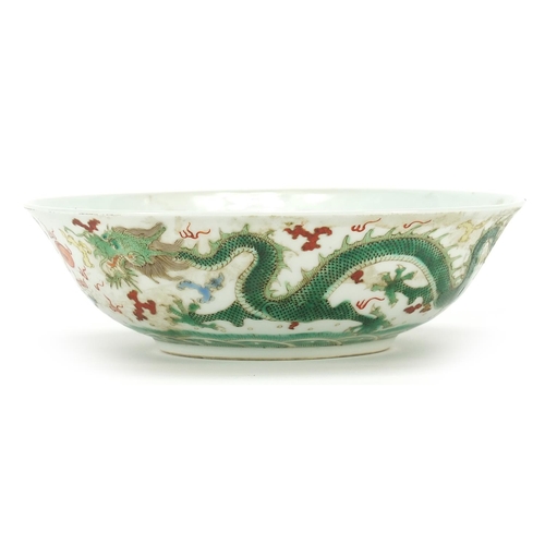 79 - Chinese porcelain bowl hand painted with two dragons chasing a flaming pearl, 20.5cm in diameter