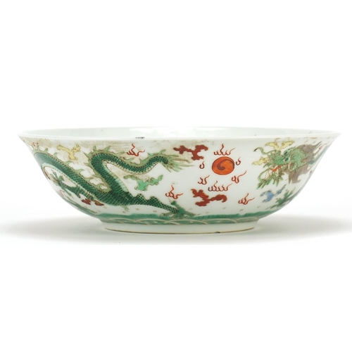 79 - Chinese porcelain bowl hand painted with two dragons chasing a flaming pearl, 20.5cm in diameter