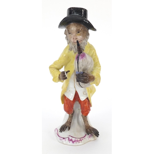 39 - 19th century continental porcelain monkey musician, 15cm high