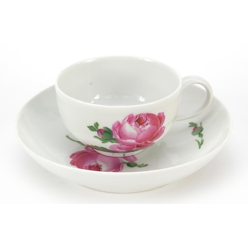 44 - Meissen, 19th century porcelain cup and saucer hand painted with flowers, the saucer 14cm in diamete... 