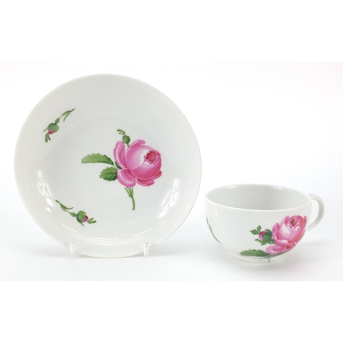 44 - Meissen, 19th century porcelain cup and saucer hand painted with flowers, the saucer 14cm in diamete... 