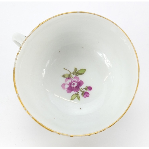 46 - Meissen, 19th century porcelain cup and saucer hand painted with flowers, the saucer 13.5cm in diame... 