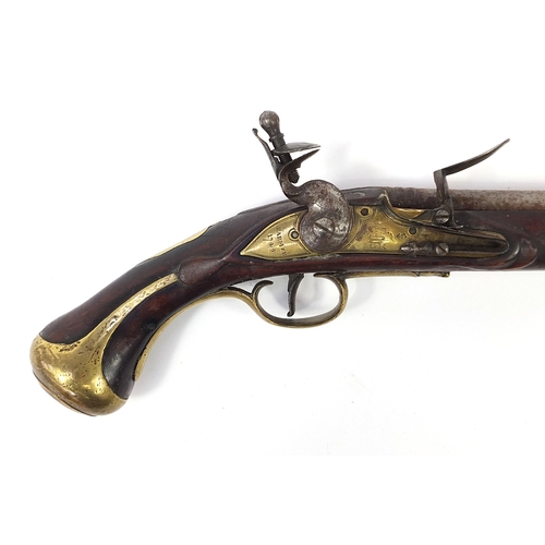 1441 - Antique flintlock pistol with brass mounts, the lock plate with engraved GR cypher and inscribed Far... 
