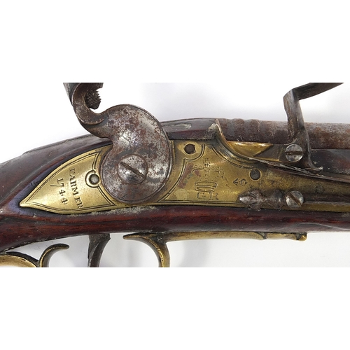1441 - Antique flintlock pistol with brass mounts, the lock plate with engraved GR cypher and inscribed Far... 