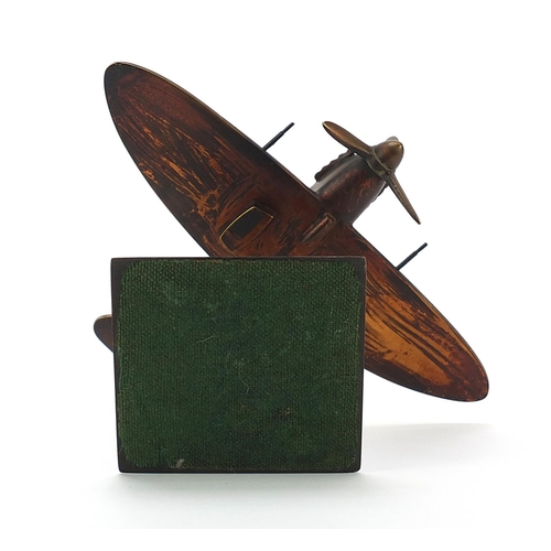 1440 - Military interest metal model Spitfire on stand, 11cm high