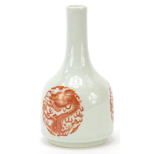 50 - Chinese porcelain bottle vase hand painted in iron red with three dragons chasing a flaming pearl am... 
