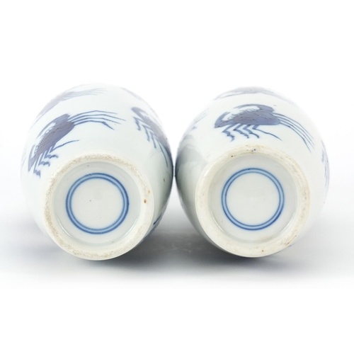 7 - Pair of Chinese blue and white porcelain vases hand painted with crabs, blue ring marks to the bases... 