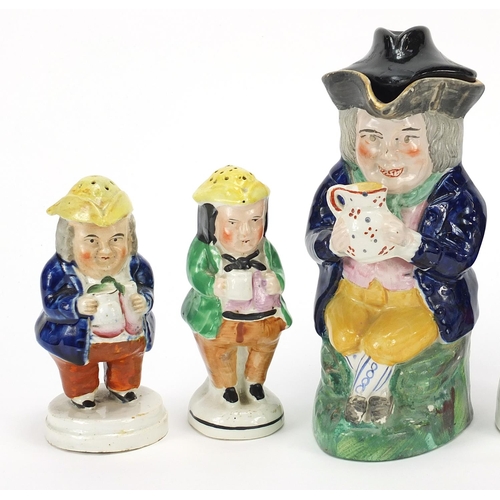 134 - 19th century Staffordshire pottery including four figural sifters, the largest 20cm high