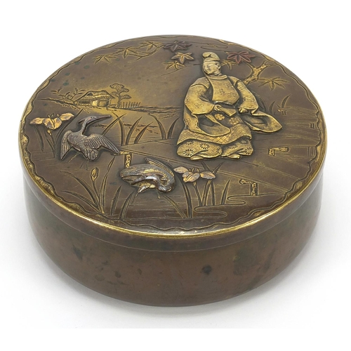 133 - Japanese mixed metal box and cover decorated in relief with a figure and animals, character marks to... 