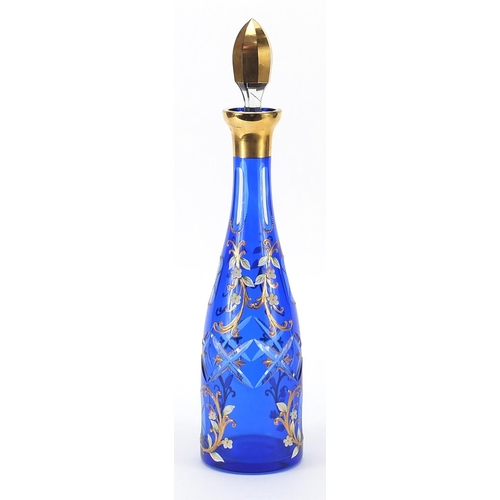 44 - Attributed to Moser, Bohemian blue overlaid glass decanter enamelled with flowers, 40cm high