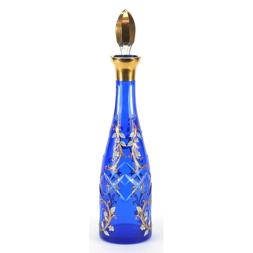 44 - Attributed to Moser, Bohemian blue overlaid glass decanter enamelled with flowers, 40cm high
