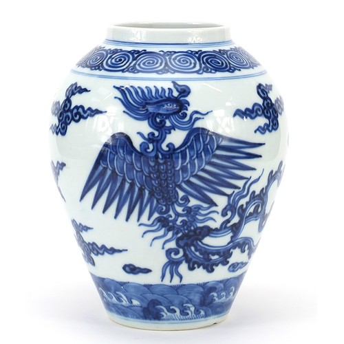 16 - Chinese blue and white porcelain vase hand painted with phoenixes raised on carved hardwood stand, t... 