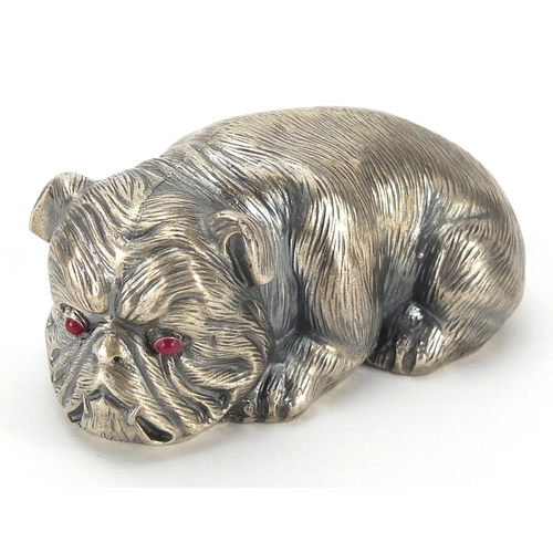 39 - Silver recumbent Bulldog with ruby eyes, impressed Russian marks to the base, 6.5cm in length, 60.2g