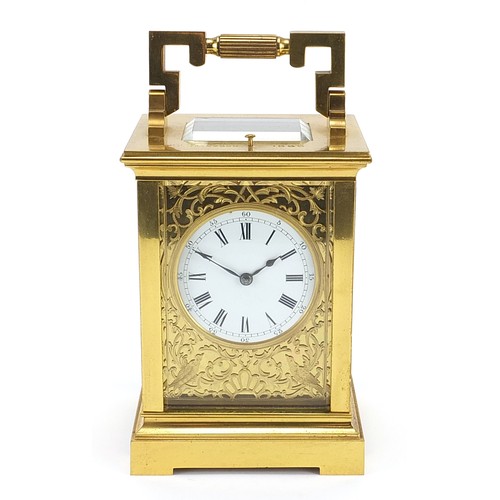 26 - French brass cased repeating carriage clock with fret panels and enamelled dial, the backplate and k... 