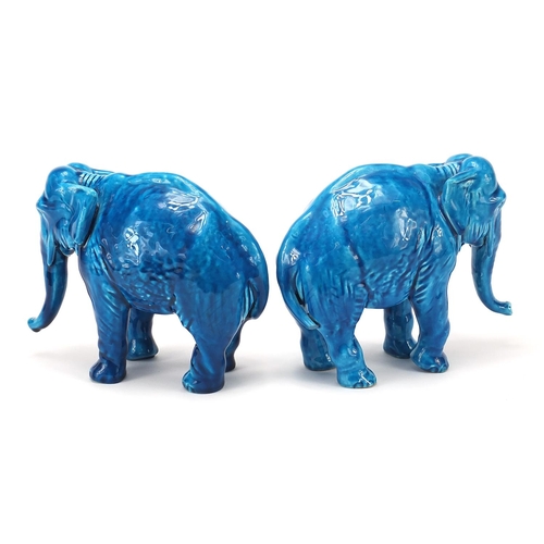 10 - Pair of continental Majolica blue glazed elephants, each 18.5cm in length