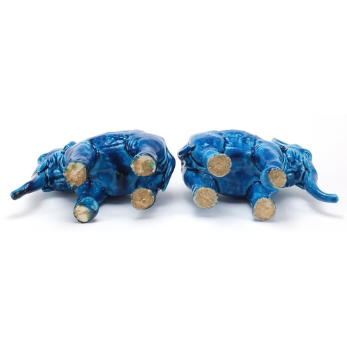 10 - Pair of continental Majolica blue glazed elephants, each 18.5cm in length