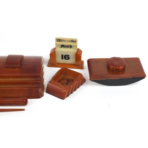 8 - Art Deco Carvacraft butterscotch amber coloured Bakelite desk set comprising a double inkwell, notep... 
