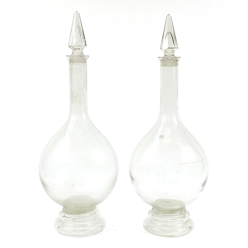 40 - Pair of large 19th century apothecary glass jars with stoppers, each 81cm high