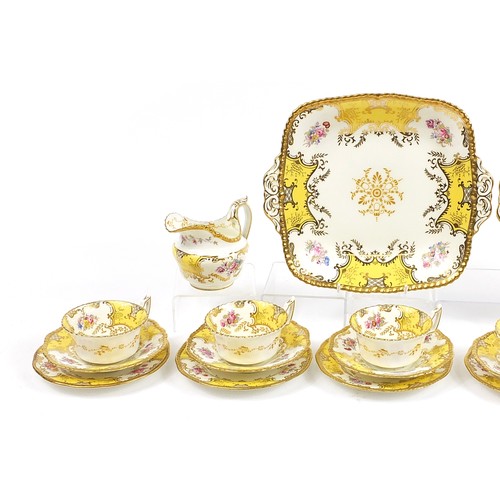 7 - Coalport yellow ground six place batwing tea service decorated with flowers, comprising six trios, m... 