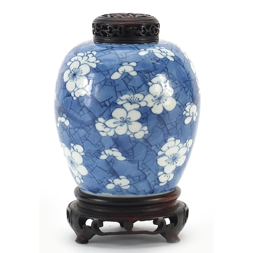 2 - Chinese blue and white porcelain ginger jar hand painted with prunus flowers on carved hardwood stan... 