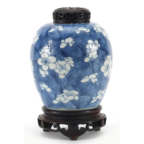 2 - Chinese blue and white porcelain ginger jar hand painted with prunus flowers on carved hardwood stan... 