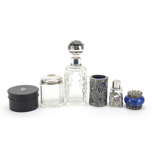 Six scent bottles and jars, some with silver mounts, the largest 17cm high