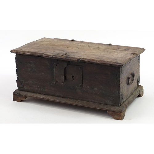 28 - 17th/18th century oak casket with iron carrying handles and pin hinges, 21.5cm H x 48.5cm W x 28.5cm... 