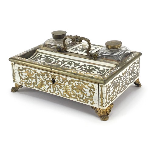 26 - 19th century ivory and horn desk stand with brass foliate inlay, fitted with two glass inkwells and ... 