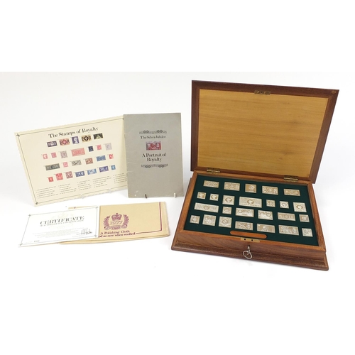 38 - The Stamps of Royalty, twenty five Silver stamp ingots  housed in a fitted inlaid wooden case, 35cm ... 