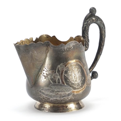 40 - Russian silver jug engraved with flowers, impressed marks to the base, 10cm high, 101.0g