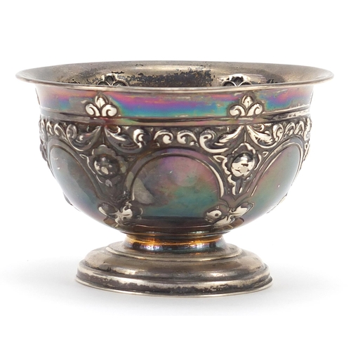 19 - Silver pedestal bowl embossed with swags and flowers, indistinct marks, 7cm high x 11.5cm in diamete... 