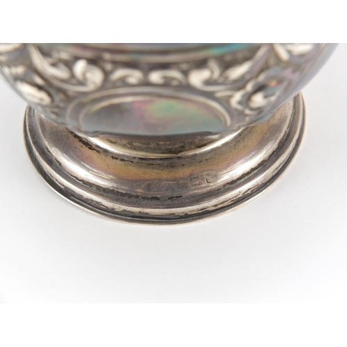 19 - Silver pedestal bowl embossed with swags and flowers, indistinct marks, 7cm high x 11.5cm in diamete... 