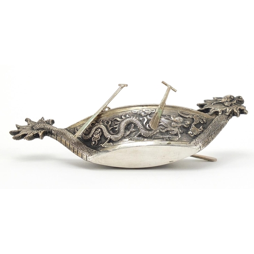 46 - Chinese silver coloured metal model of a dragon boat, 10.5cm in length, 29.8g