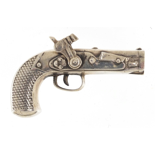 55 - Heavy silver model of a percussion pistol, 7.8cm in length, 89.0g