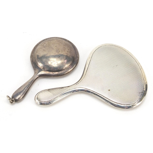 49 - Two miniature silver hand mirrors, one with compact compartment, the largest 8cm in length, total 40... 