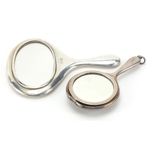 49 - Two miniature silver hand mirrors, one with compact compartment, the largest 8cm in length, total 40... 