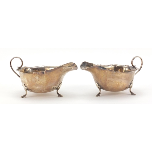 59 - Mappin & Webb, pair of George V silver three footed sauce boats, 15cm in length, 169.0g