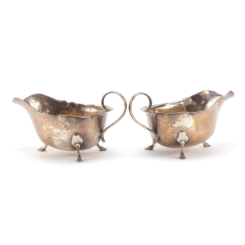 59 - Mappin & Webb, pair of George V silver three footed sauce boats, 15cm in length, 169.0g