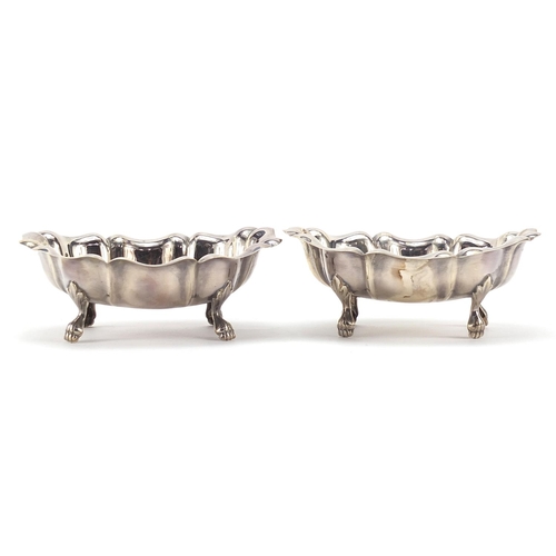 53 - Victoria Silverware Ltd, pair of silver dishes raised on four paw feet, Birmingham 1999, 11cm wide, ... 